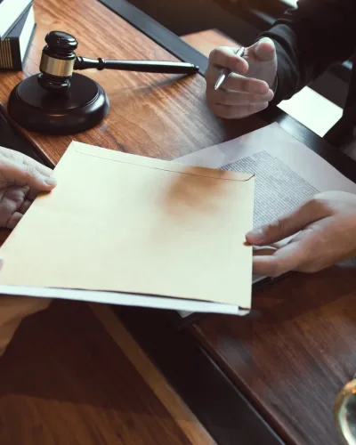 Client is submitting information on the paper of the prosecution document to the lawyer.